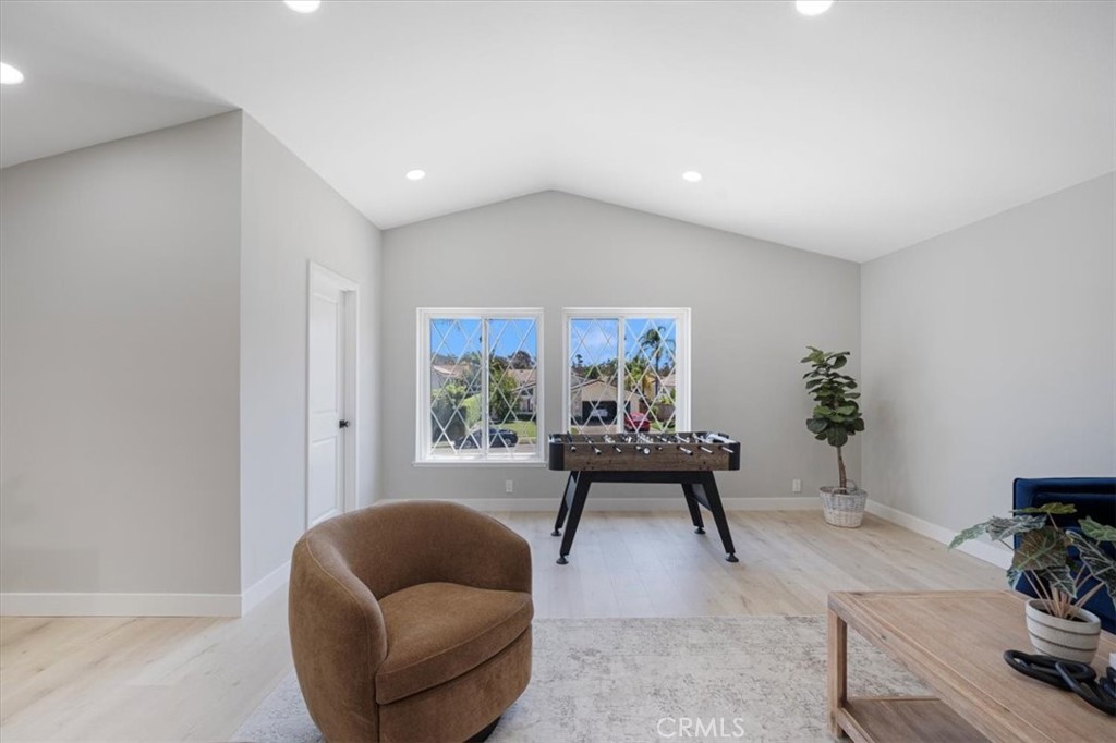 25032 Crystal Circle Lake Forest, CA 92630 - Photo 37 of 54 a living room with furniture and a potted plant