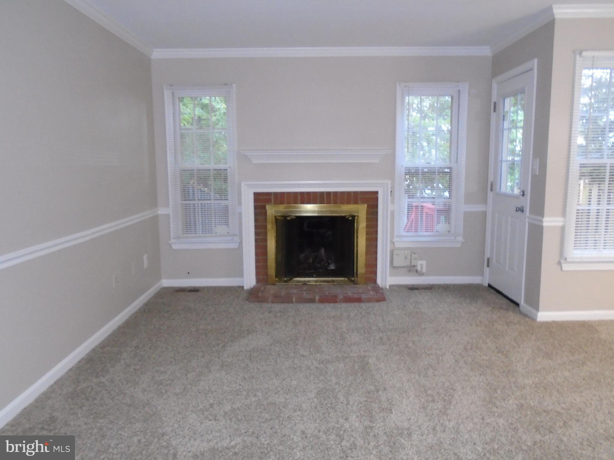 1914 Duffield Lane Alexandria, VA 22307 - Photo 11 of 50 a view of empty room with furniture and a fireplace