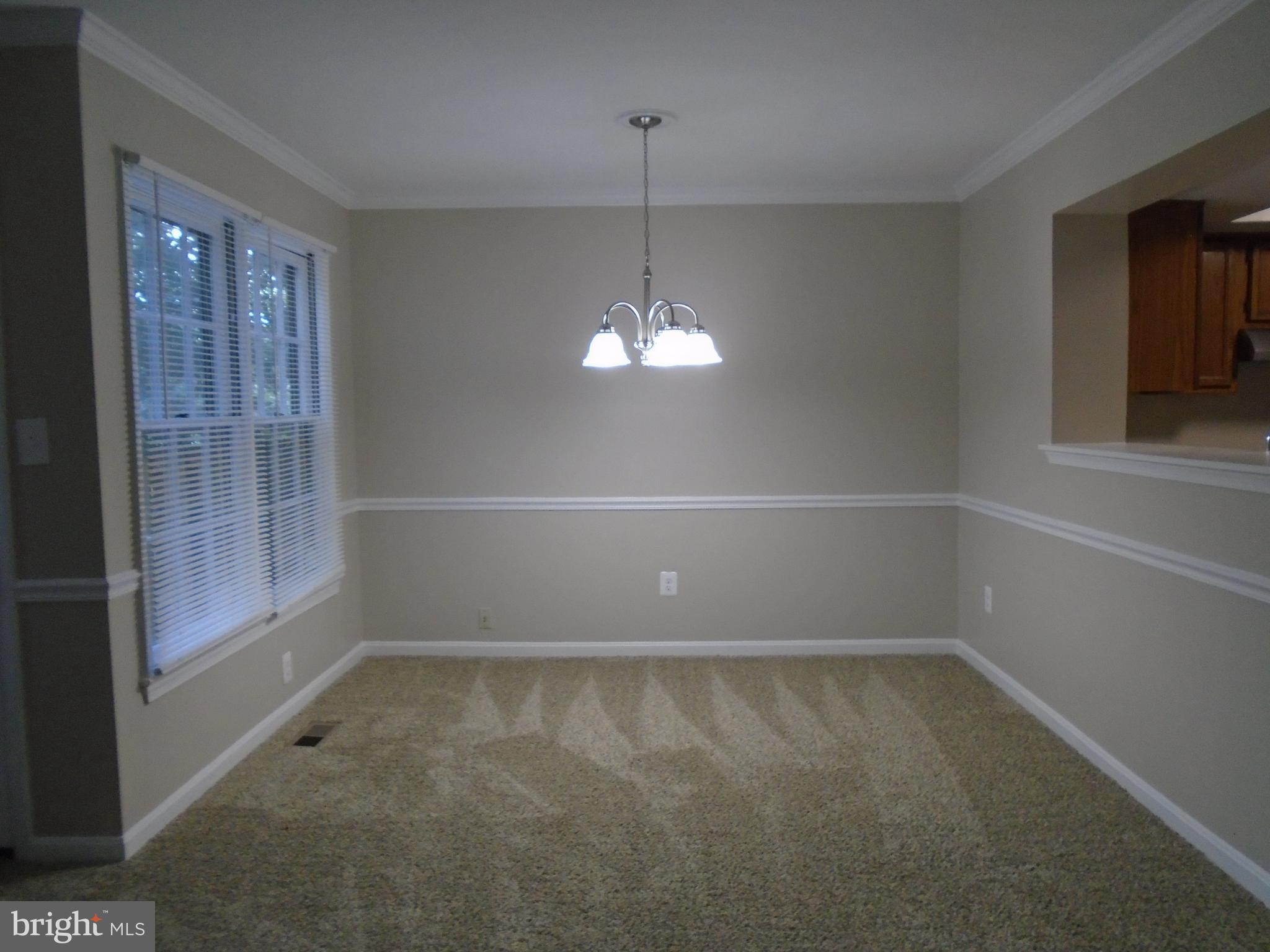 1914 Duffield Lane Alexandria, VA 22307 - Photo 13 of 50 a view of empty room with wooden floor and fan