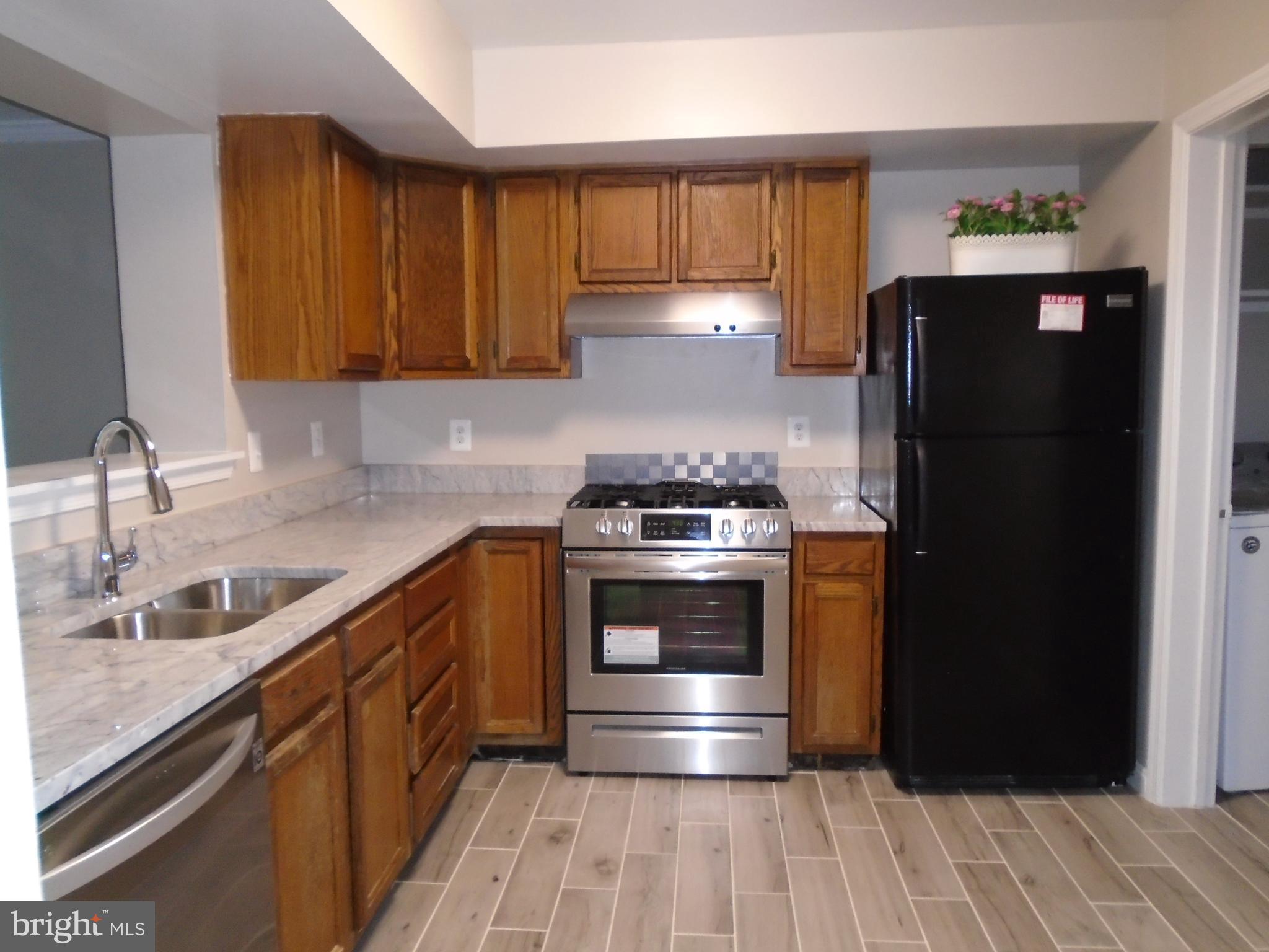 1914 Duffield Lane Alexandria, VA 22307 - Photo 2 of 50 a kitchen with a refrigerator and a sink