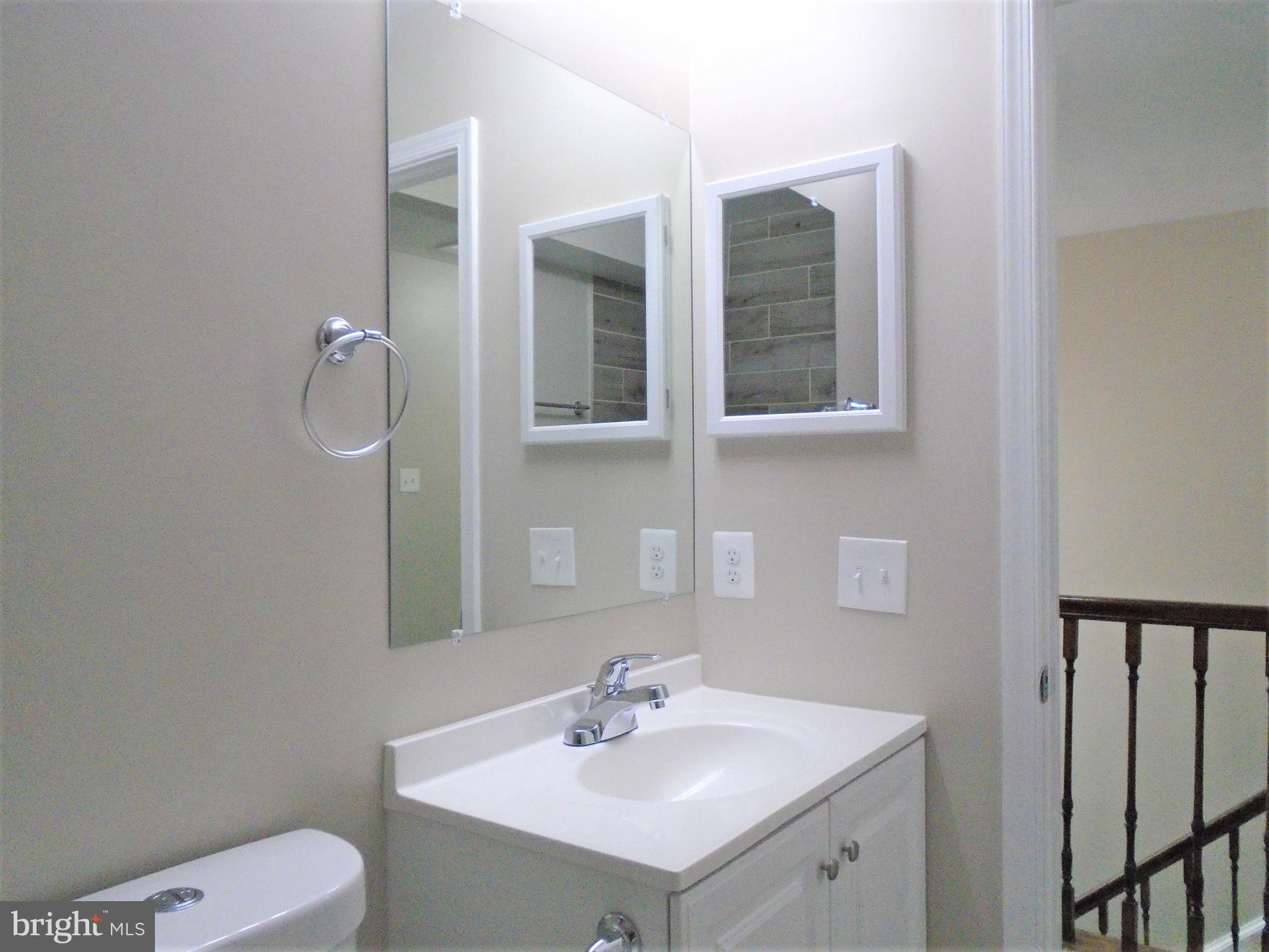 1914 Duffield Lane Alexandria, VA 22307 - Photo 27 of 50 a bathroom with a sink toilet and mirror