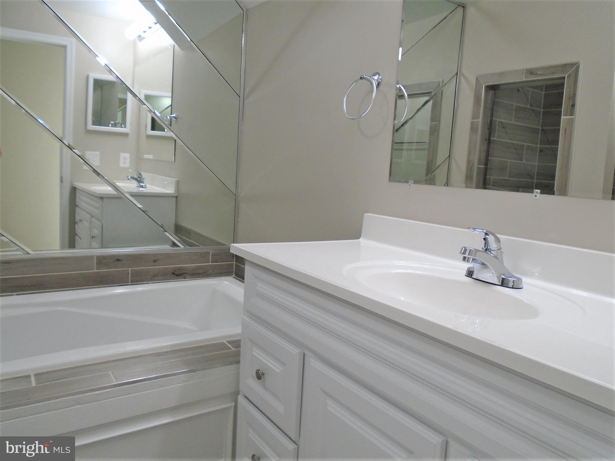 1914 Duffield Lane Alexandria, VA 22307 - Photo 29 of 50 a bathroom with a sink and a mirror