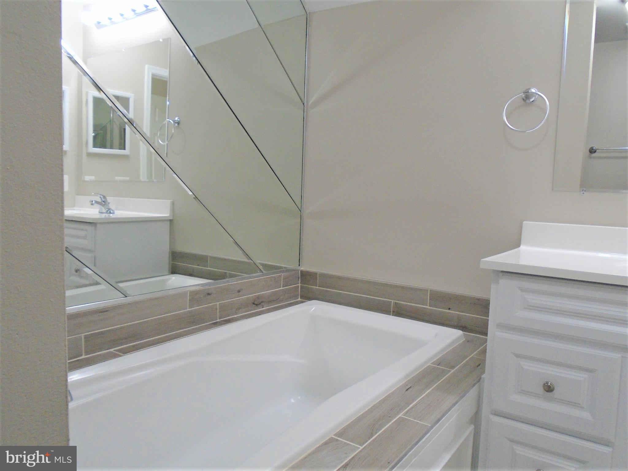 1914 Duffield Lane Alexandria, VA 22307 - Photo 31 of 50 a bathroom with a bathtub and shower