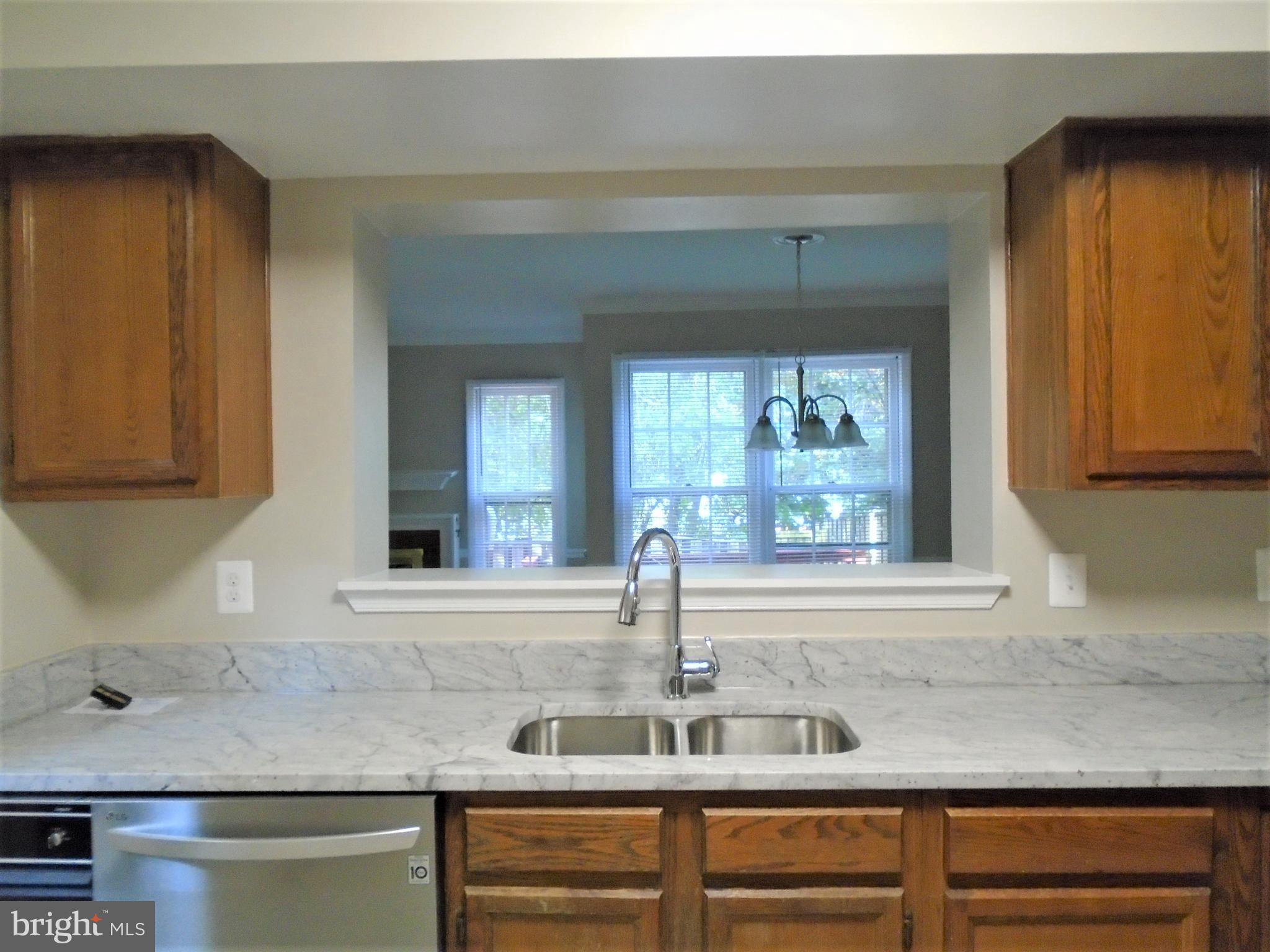 1914 Duffield Lane Alexandria, VA 22307 - Photo 5 of 50 a kitchen with granite countertop white cabinets and a window
