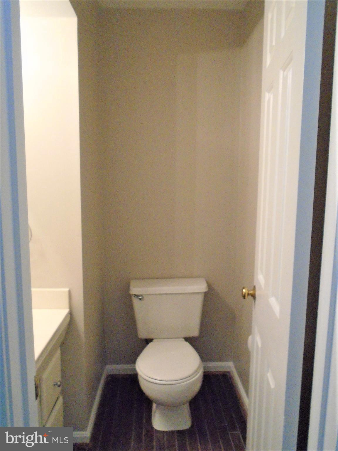 1914 Duffield Lane Alexandria, VA 22307 - Photo 9 of 50 a white toilet sitting in a bathroom next to a window