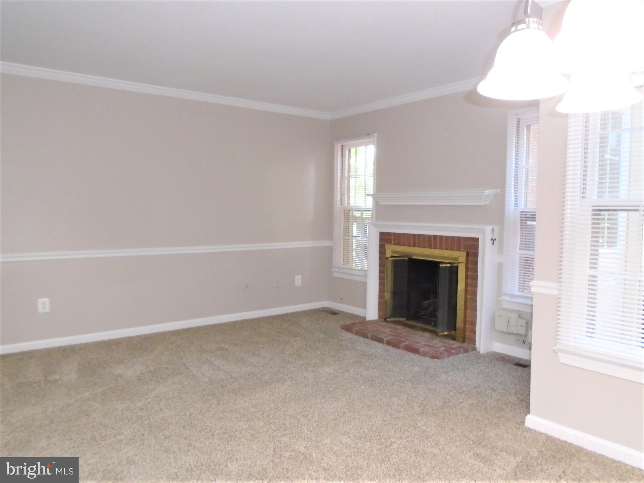 1914 Duffield Lane Alexandria, VA 22307 - Photo 10 of 50 a view of an empty room with a window and fireplace