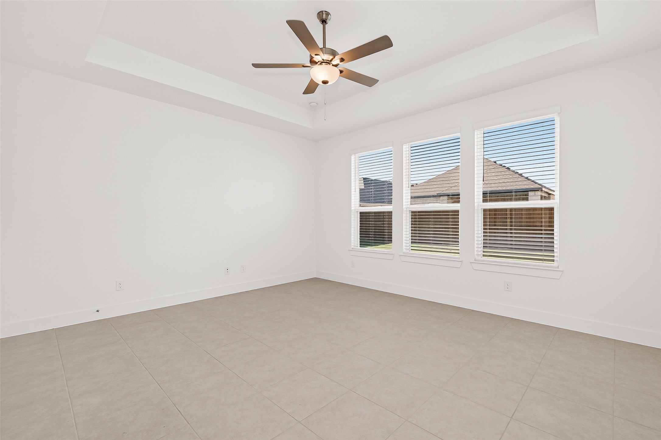 4916 Northern Wds Drive Spring, TX 77386 - Photo 36 of 44 an empty room with a window and a ceiling fan