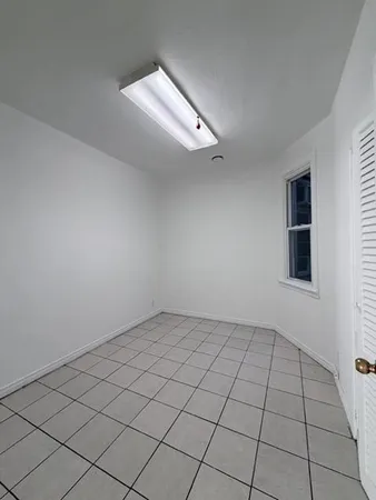 a view of an empty room and window
