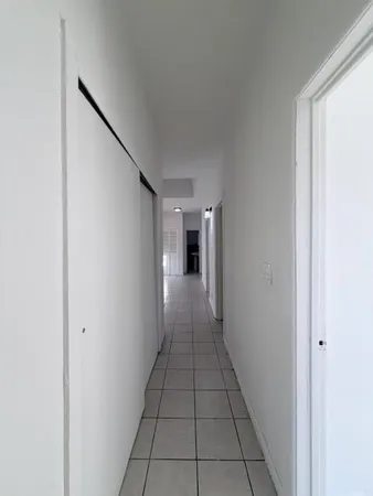 a view of a hallway with a furniture