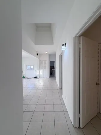 a view of a room with a window and storage area