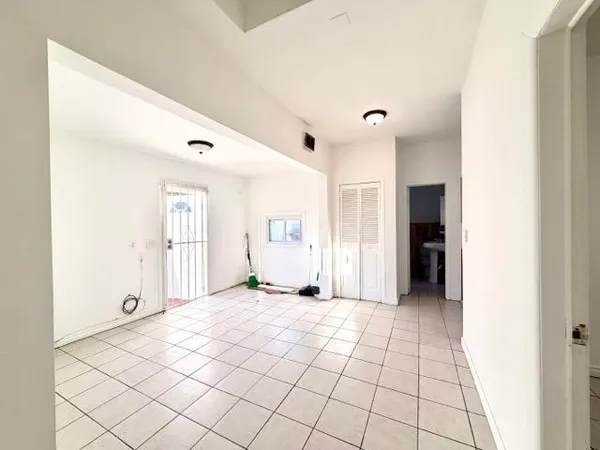 a view of an empty room and window