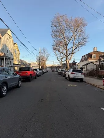 a view of a city street with cars