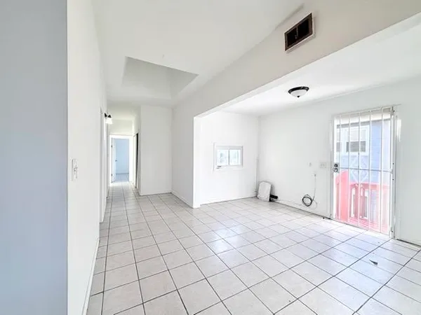 a view of an empty room and window