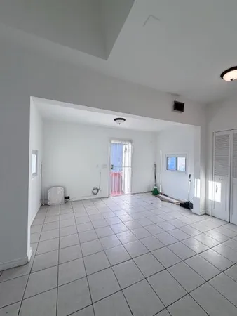 a view of an empty room and window