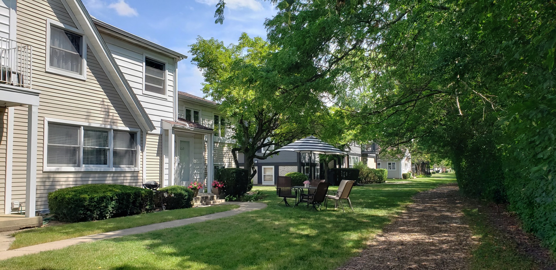 630 Inverrary Lane, Unit 630 Deerfield, IL 60015 - Photo 1 of 5 a view of a house with backyard and sitting area
