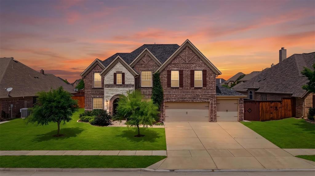 2217 Riviera Drive Little Elm, TX 75068 - Photo 1 of 36 Brick and stone facade residence featuring a multi-gable roofline