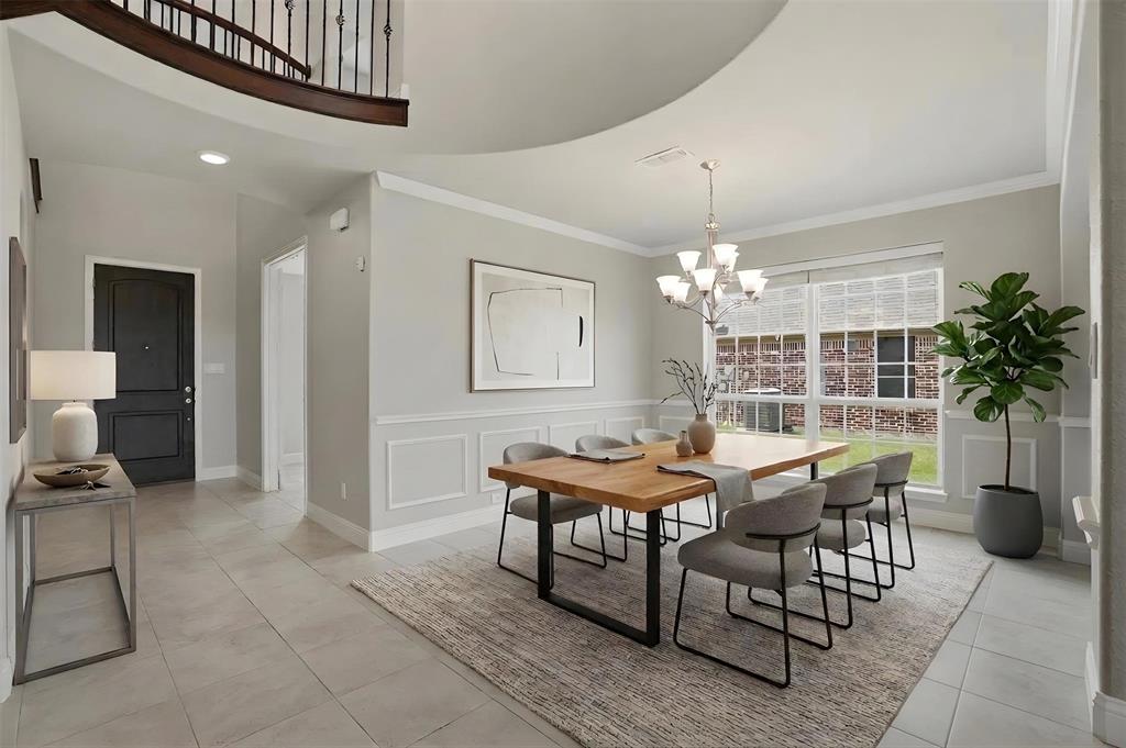 2217 Riviera Drive Little Elm, TX 75068 - Photo 12 of 36 Formal dining area featuring wainscoting and a multi-pane window
