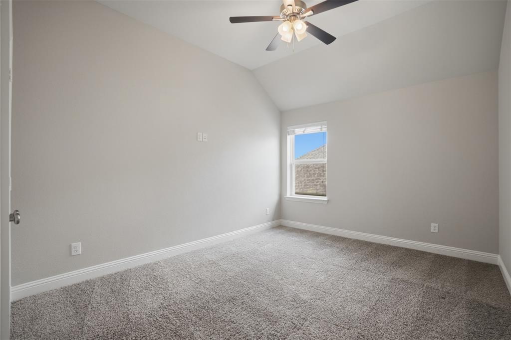2217 Riviera Drive Little Elm, TX 75068 - Photo 28 of 36 Carpeted room featuring a vaulted ceiling and a ceiling fan with integrated lighting