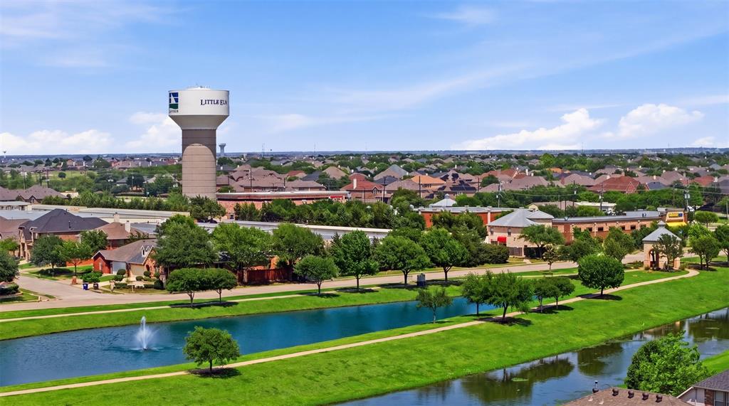 2217 Riviera Drive Little Elm, TX 75068 - Photo 33 of 36 Aerial perspective showcasing a residential area with a prominent water tower