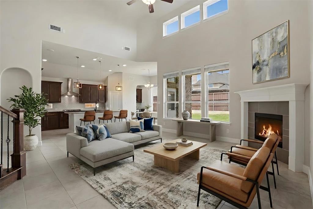 2217 Riviera Drive Little Elm, TX 75068 - Photo 4 of 36 Spacious living area featuring a vaulted ceiling and an open-concept design