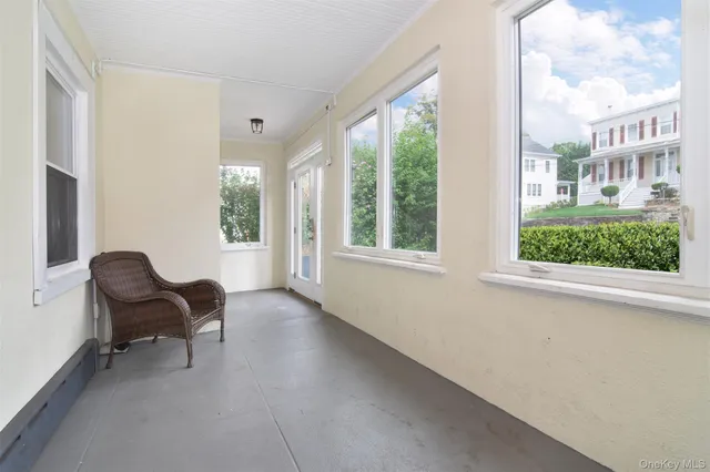 a view of living room filled with furniture and a large window