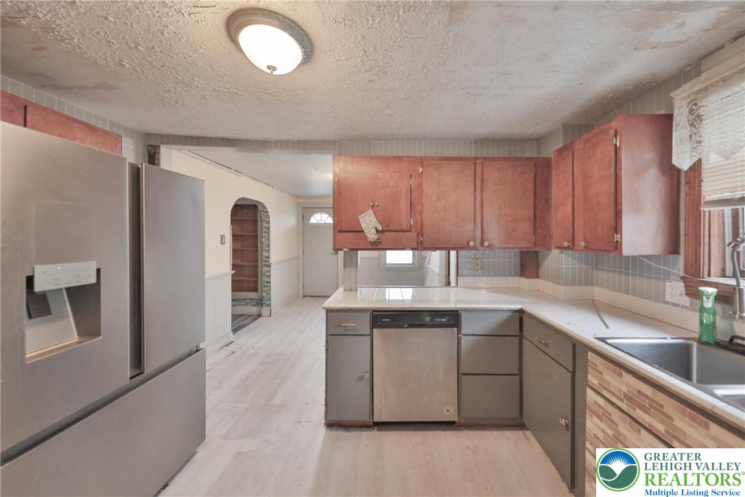 1291 Seidersville Road Bethlehem, PA 18015 - Photo 13 of 56 a kitchen with a sink window and cabinets