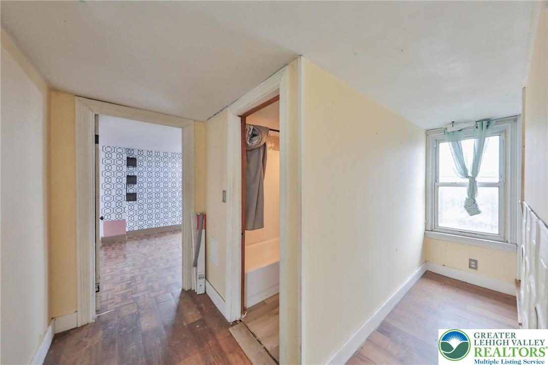 1291 Seidersville Road Bethlehem, PA 18015 - Photo 26 of 56 a view of hallway with wooden floor and windows