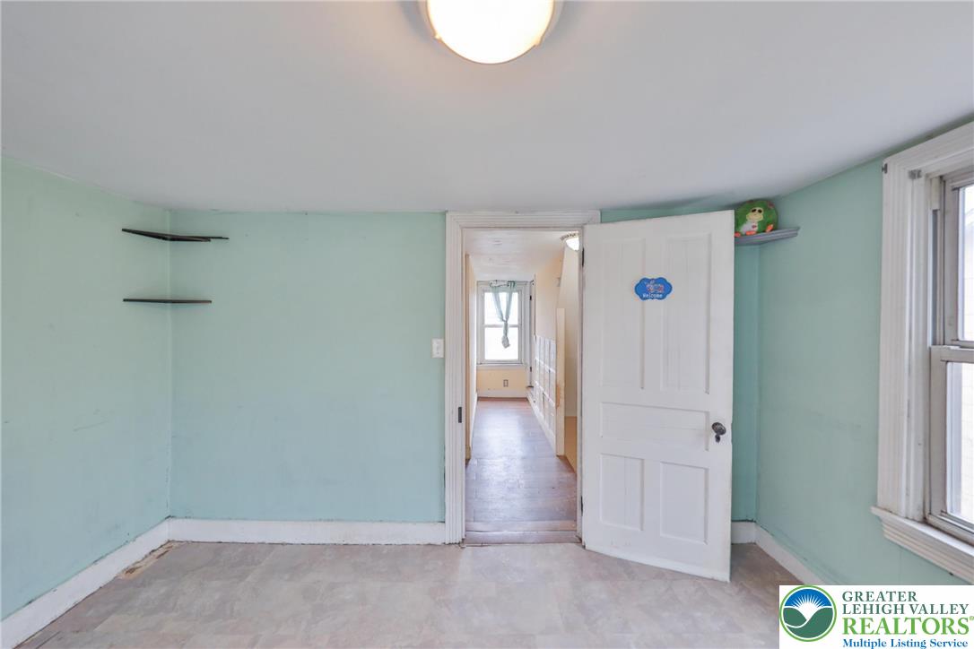 1291 Seidersville Road Bethlehem, PA 18015 - Photo 36 of 56 an empty room with wooden floor and windows