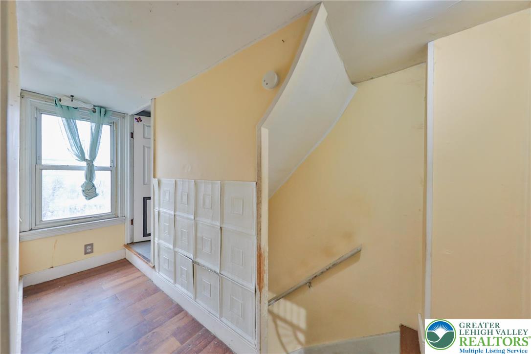 1291 Seidersville Road Bethlehem, PA 18015 - Photo 38 of 56 a view of a hallway with wooden floor and entryway