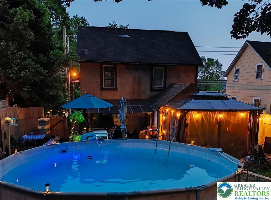 1291 Seidersville Road Bethlehem, PA 18015 - Photo 50 of 56 a view of patio with chairs and table under an umbrella