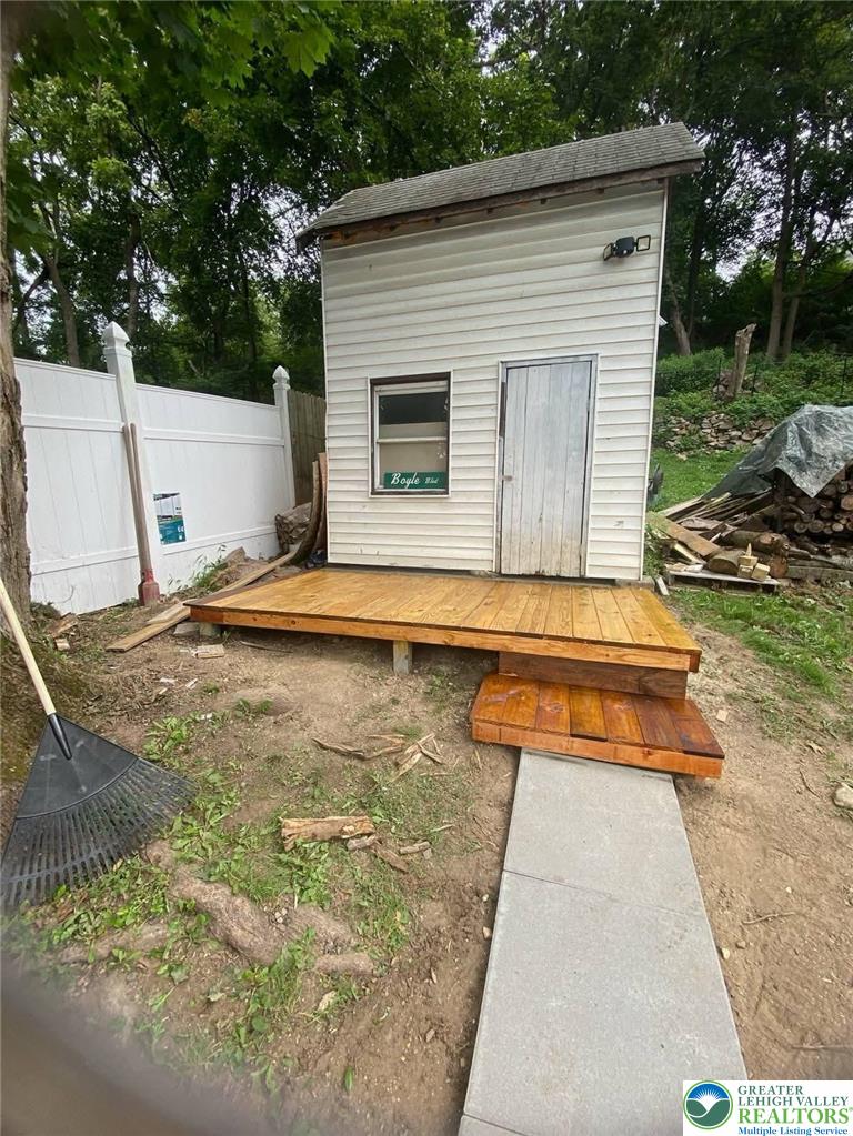 1291 Seidersville Road Bethlehem, PA 18015 - Photo 52 of 56 a backyard of a house with yard and outdoor seating