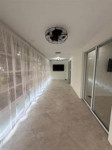 an empty room with mirror in closet