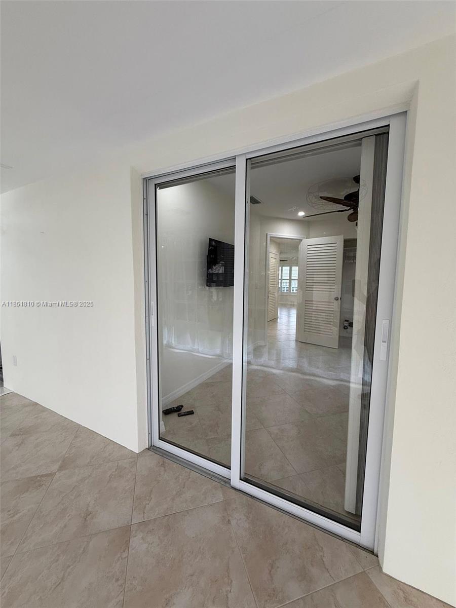 2929 Southeast Ocean Boulevard, Unit 14310 Stuart, FL 34996 - Photo 34 of 73 an empty room with mirror in closet