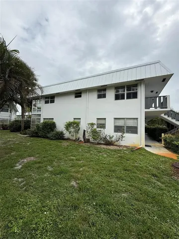 a kitchen with a refrigerator a stove a sink and a cabinets