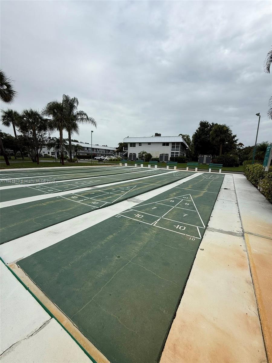 2929 Southeast Ocean Boulevard, Unit 14310 Stuart, FL 34996 - Photo 45 of 73 a view of an outdoor space and tennis court