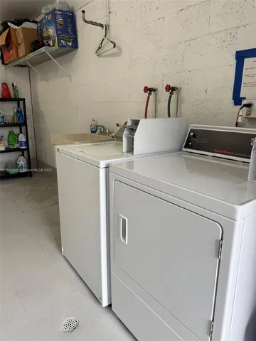 a bathroom with a double vanity sink toilet and shower