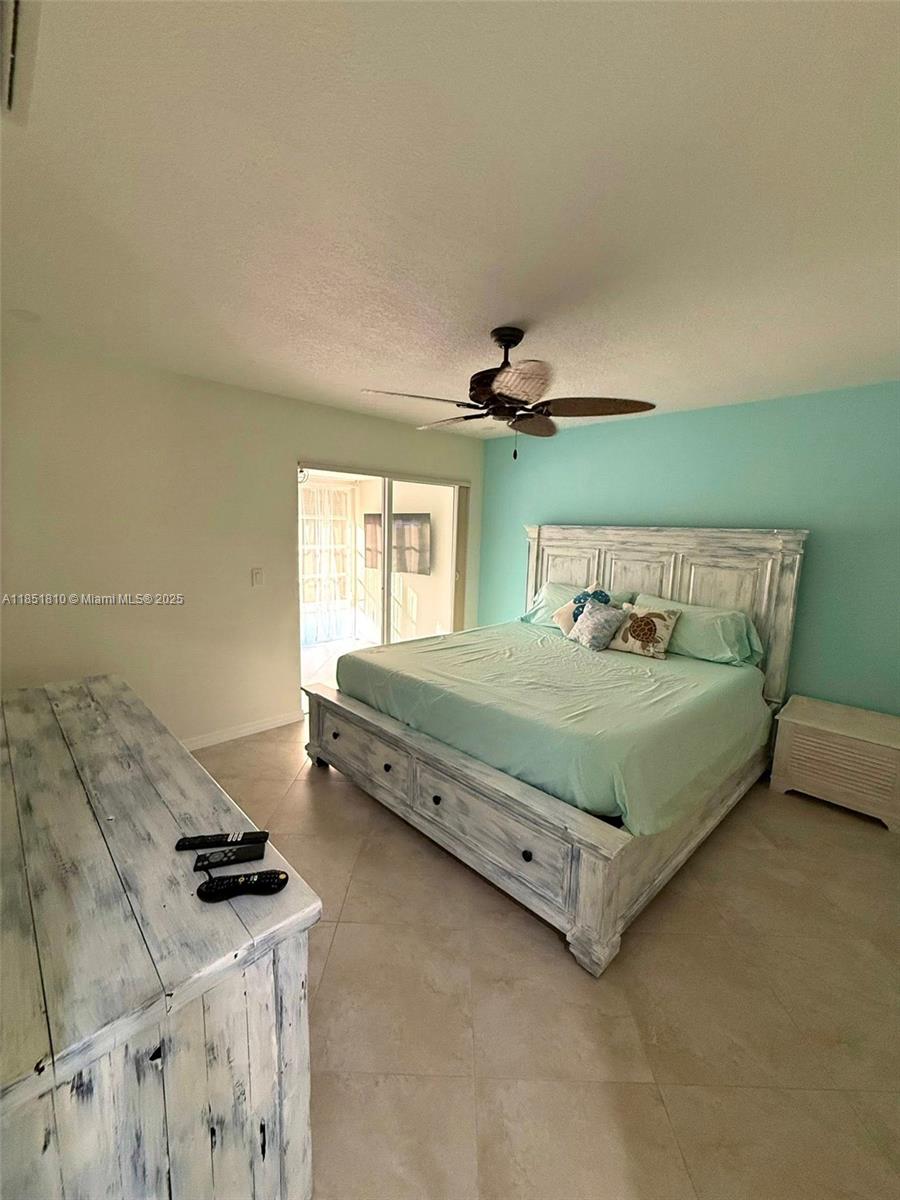 2929 Southeast Ocean Boulevard, Unit 14310 Stuart, FL 34996 - Photo 7 of 73 a bedroom with a bed and a window