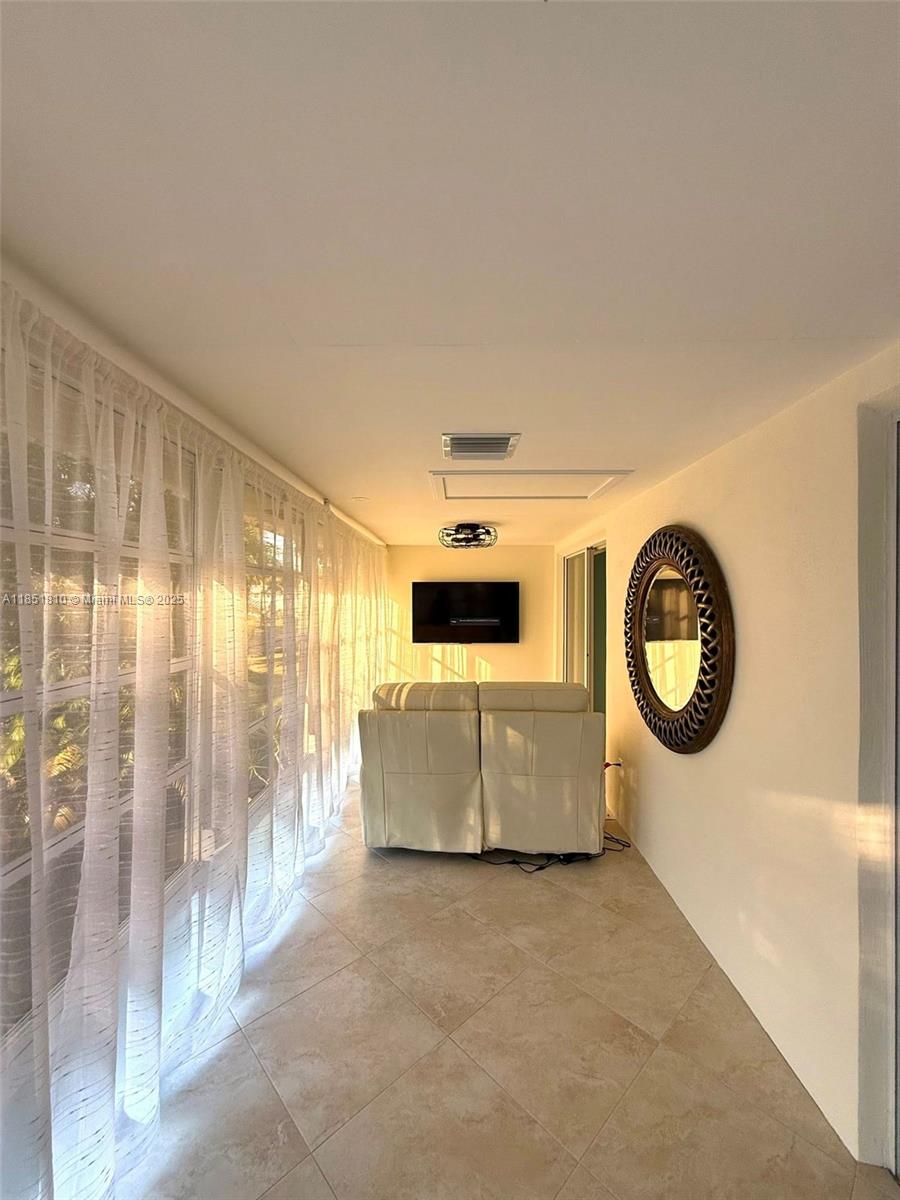 2929 Southeast Ocean Boulevard, Unit 14310 Stuart, FL 34996 - Photo 72 of 73 a living room with furniture and a large window