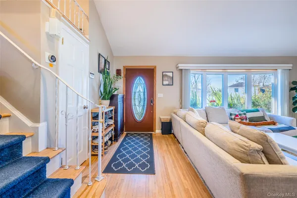 a bed room with furniture and a window