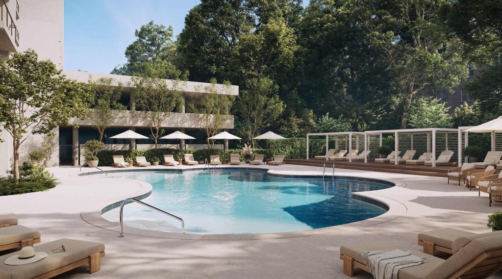 2460 Peachtree Road Northeast, Unit 514 Atlanta, GA 30305 - Photo 32 of 36 a view of a swimming pool with sitting area