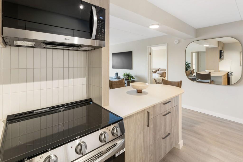2460 Peachtree Road Northeast, Unit 514 Atlanta, GA 30305 - Photo 5 of 36 a kitchen with a sink appliances and cabinets
