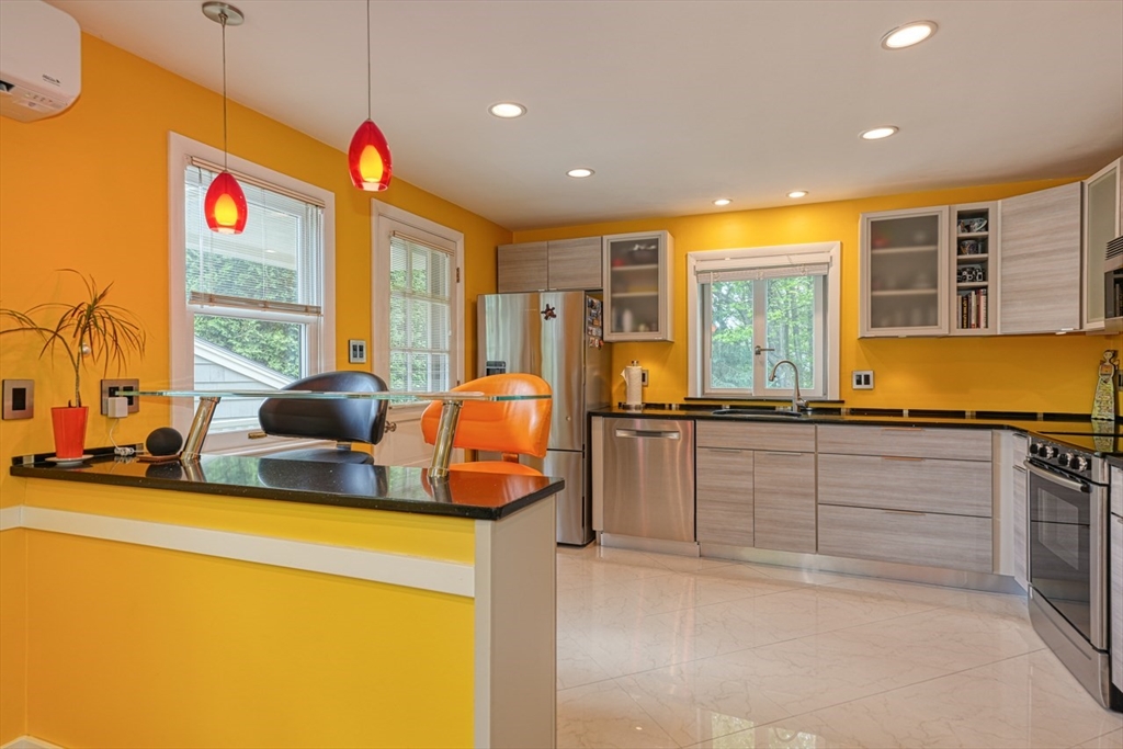 27 Wheeler Road Westborough, MA 01581 - Photo 13 of 41 a kitchen with sink a counter and cabinets