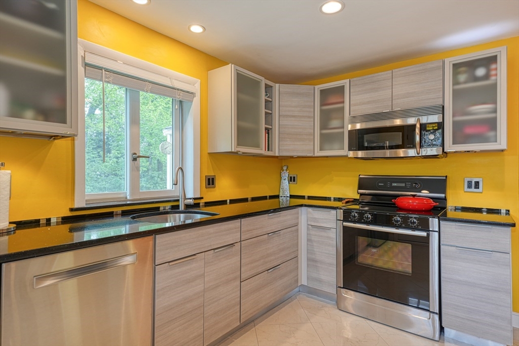 27 Wheeler Road Westborough, MA 01581 - Photo 16 of 41 a kitchen with a sink and a stove