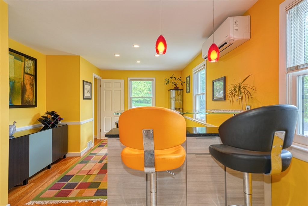 27 Wheeler Road Westborough, MA 01581 - Photo 17 of 41 a living room with a couch and a potted plant