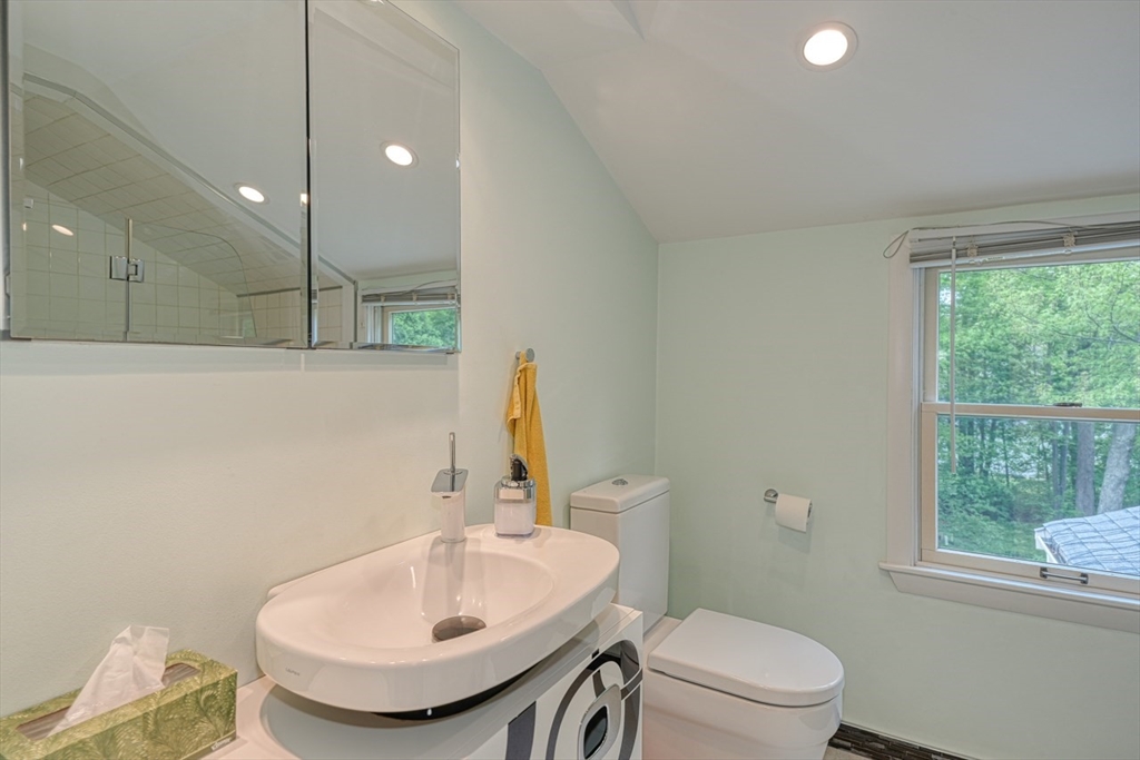 27 Wheeler Road Westborough, MA 01581 - Photo 25 of 41 a bathroom with a sink a toilet and a mirror