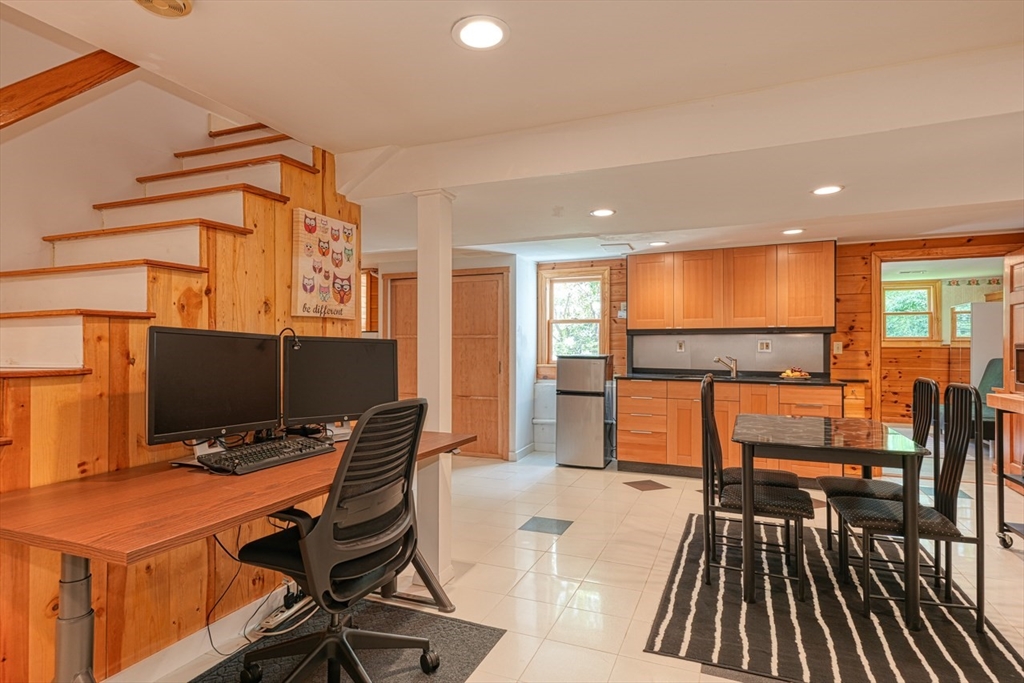 27 Wheeler Road Westborough, MA 01581 - Photo 27 of 41 a view of a workspace with furniture and wooden floor