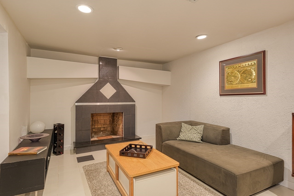27 Wheeler Road Westborough, MA 01581 - Photo 29 of 41 a living room with furniture and a fireplace
