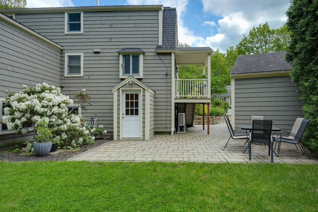 27 Wheeler Road Westborough, MA 01581 - Photo 38 of 41 a backyard of a house with table and chairs