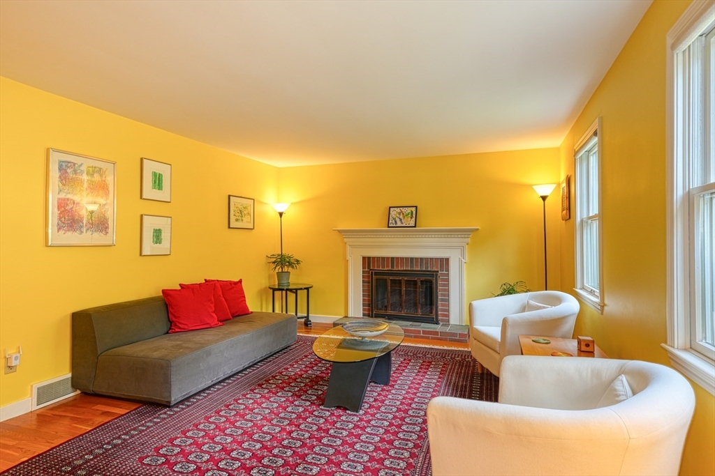 27 Wheeler Road Westborough, MA 01581 - Photo 5 of 41 a living room with furniture and a fireplace