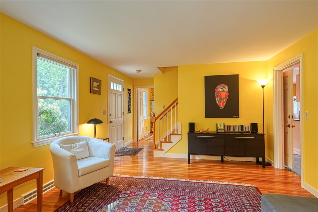 27 Wheeler Road Westborough, MA 01581 - Photo 6 of 41 a living room with furniture and a flat screen tv